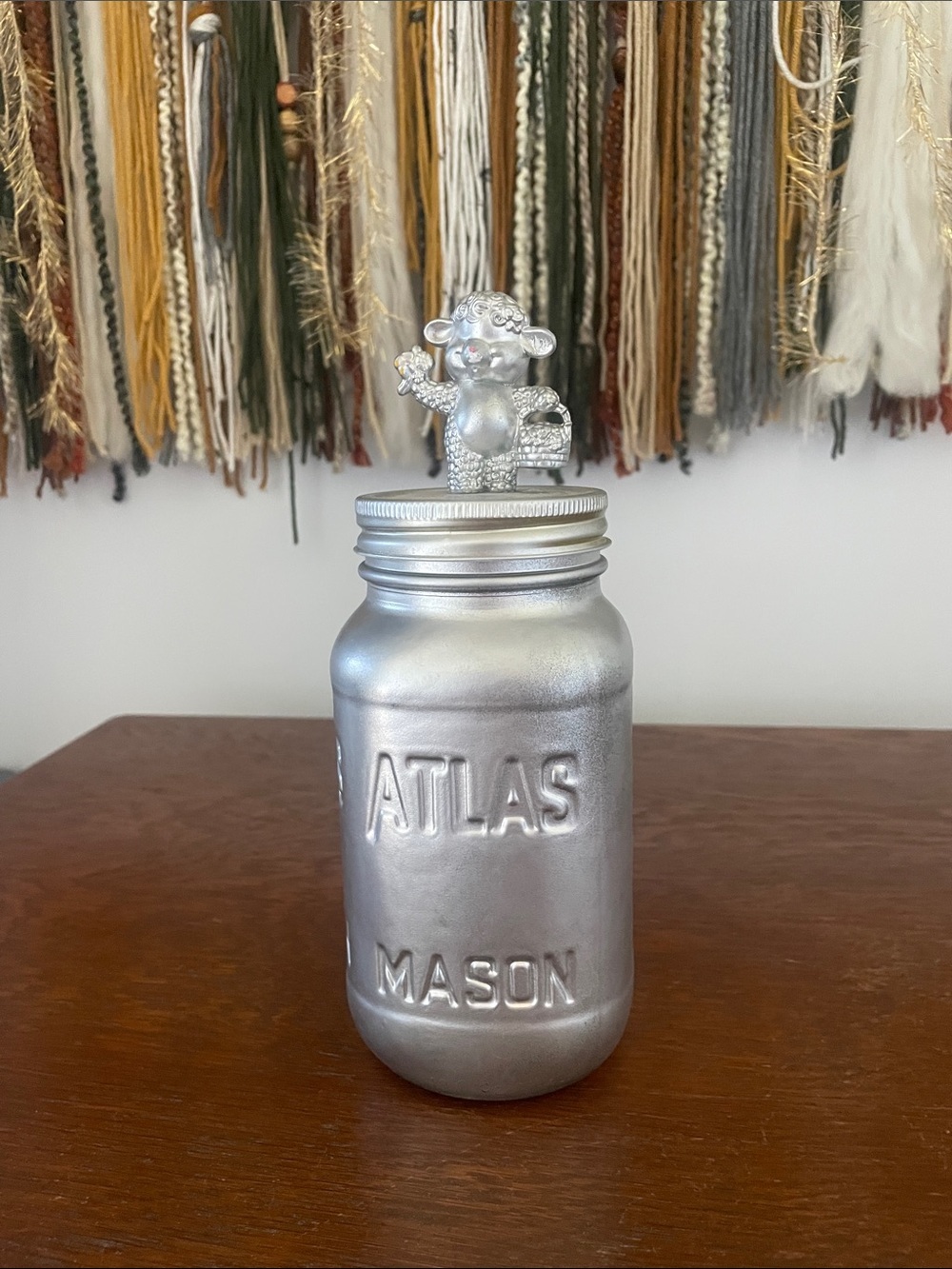 Adorable silver mason jar with sheep atop